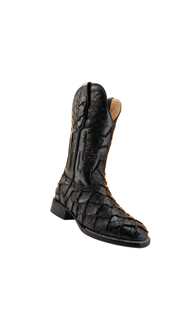 Black caiman-look boot floating on the page